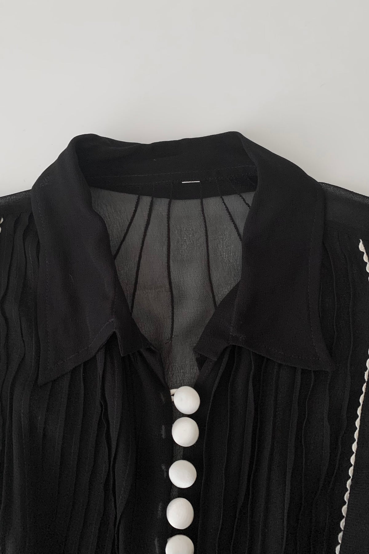 black sheer white buttons shirt