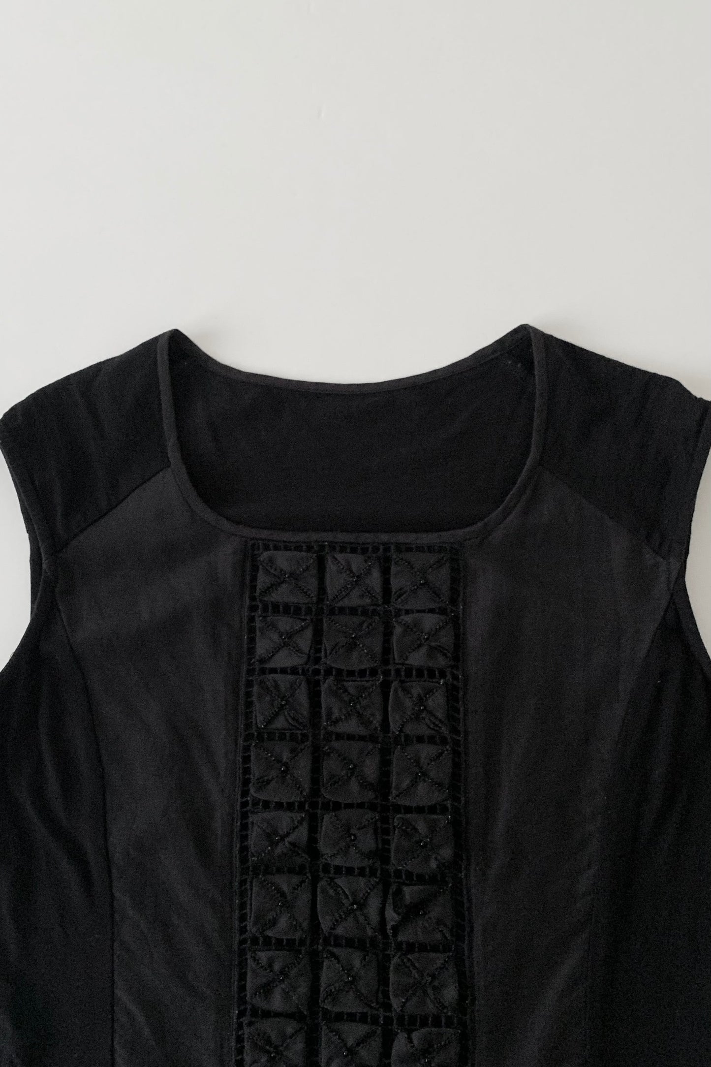 black embroidered panel design tops