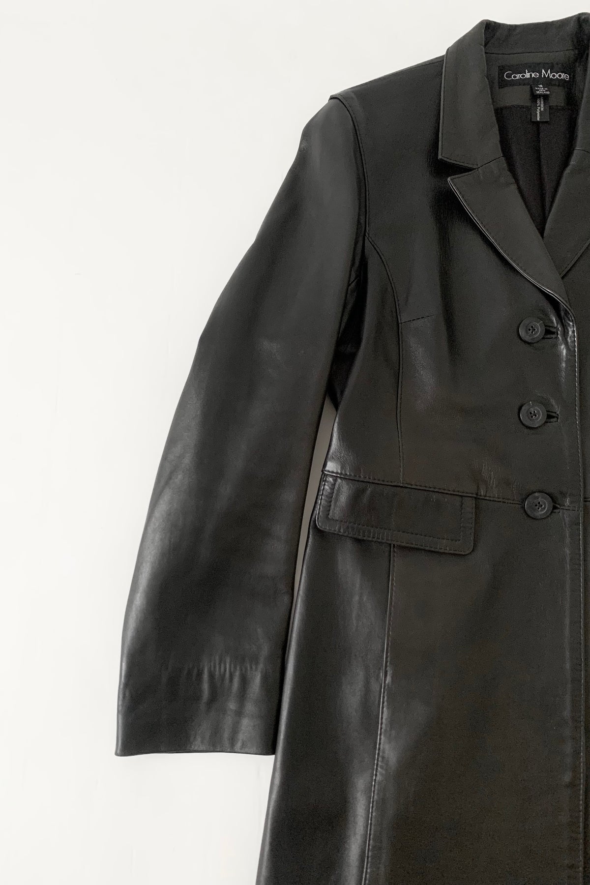 black aging leather coat