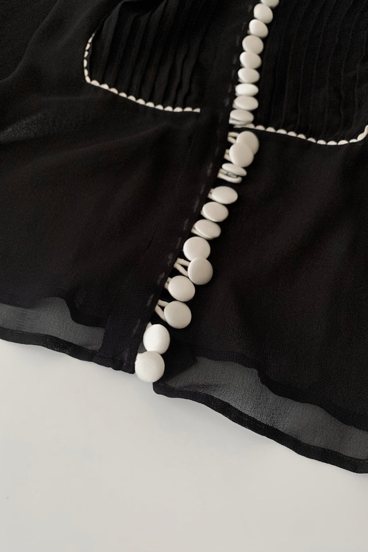 black sheer white buttons shirt