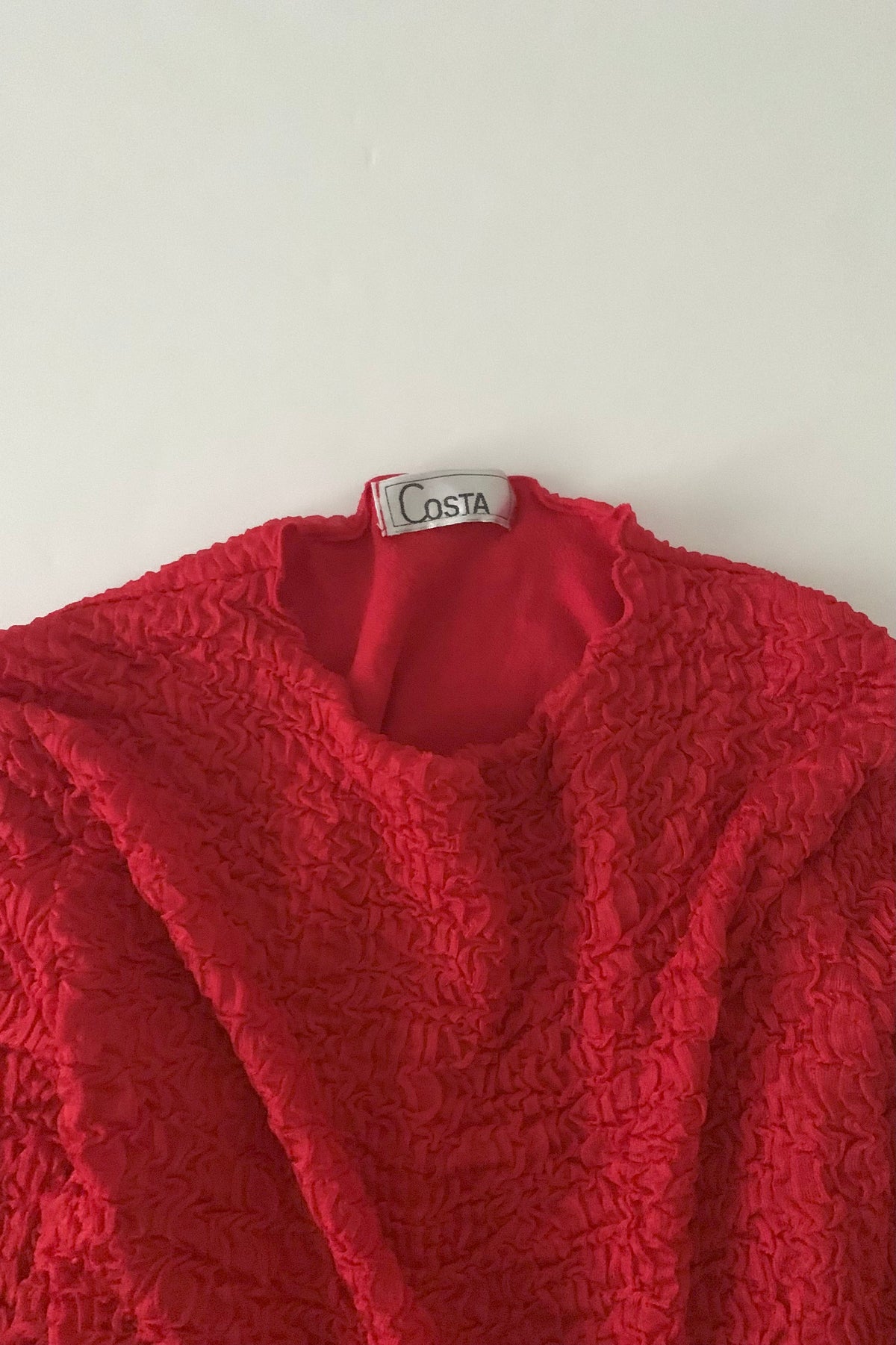 red ruffed long sleeve tops