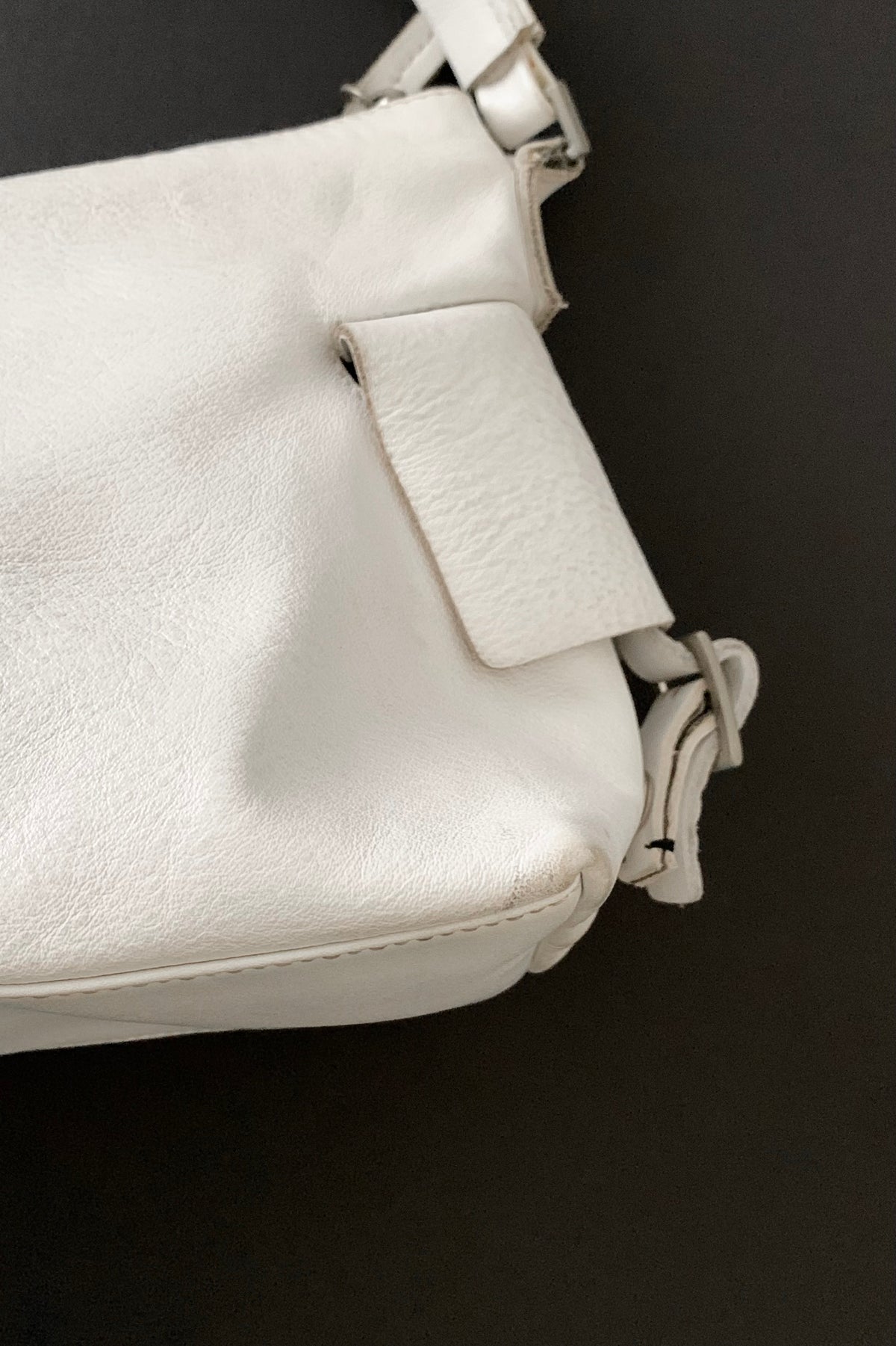 white leather side design bag